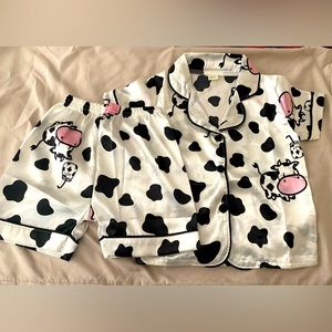 Brand new 3T/4T 2 piece cow pattern pajamas. Button front top/ elastic waist